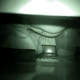 A woman is filmed from underneath a bathroom stall to observe her taking a huge dump into a floor toilet. May either be Asian or Eastern European.